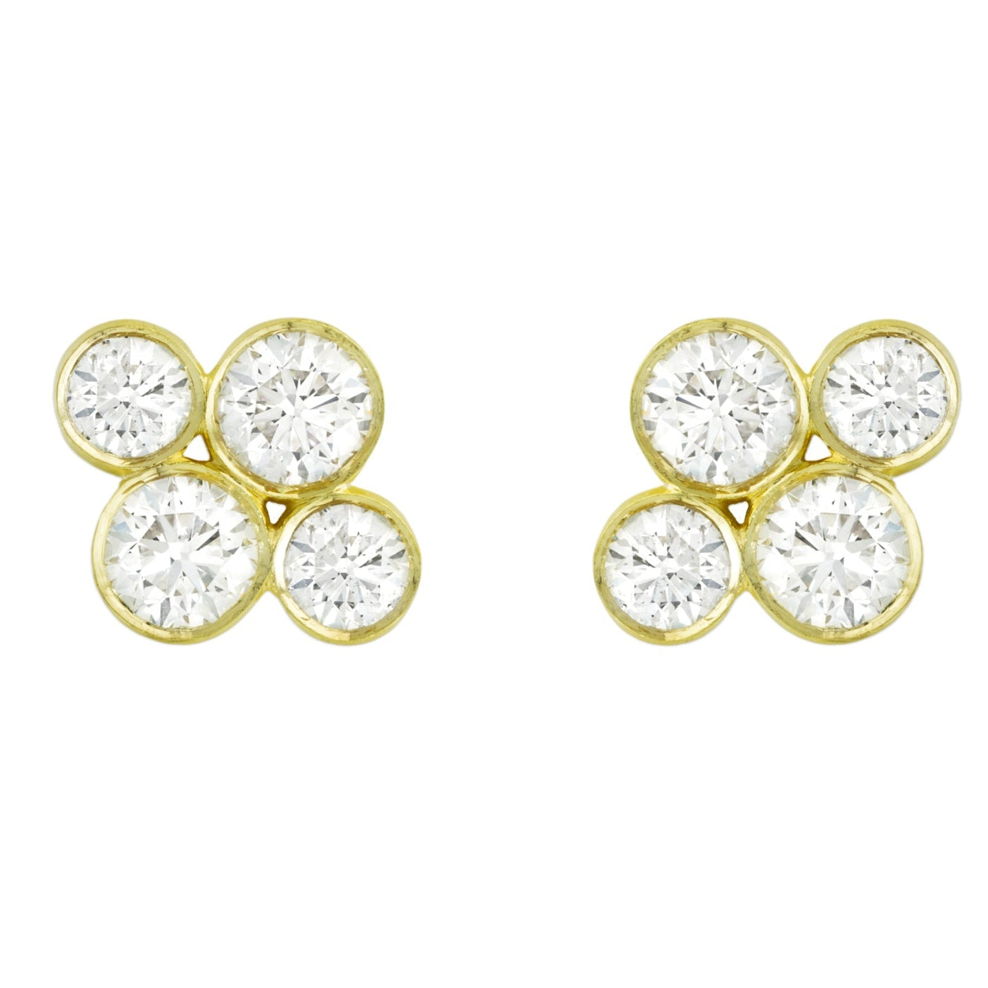 A pair of 18k yellow gold diamond stud earrings with round diamonds designed by Laura Pearce