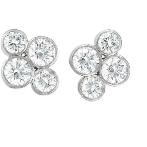 A pair of platinum diamond stud earrings designed by Laura Pearce