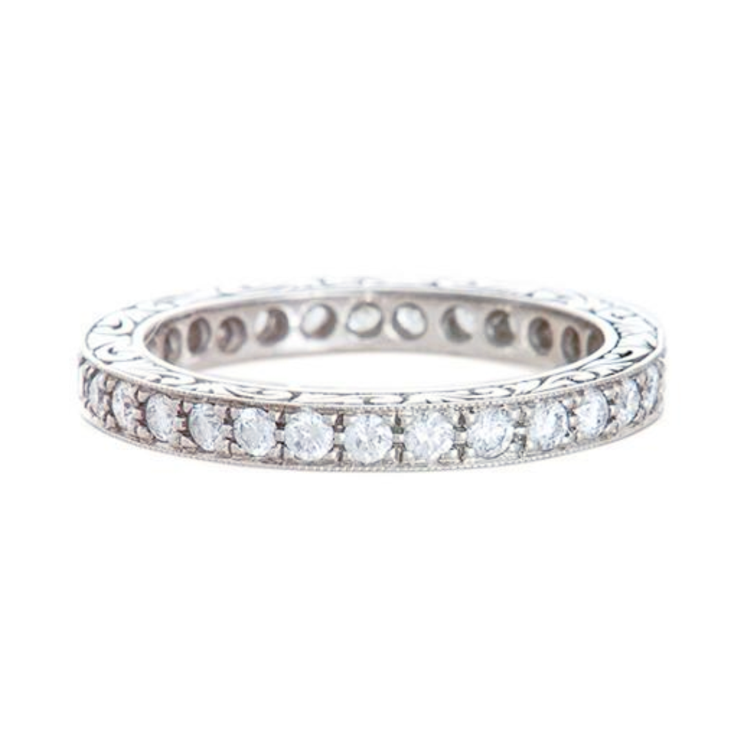 A platinum Art Deco bead set diamond eternity band with engraving on the sides, 0.6 carats