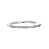 A platinum eternity band with bead set diamonds and milgrain