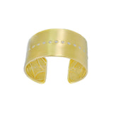 An 18K yellow gold cuff bracelet with diamonds