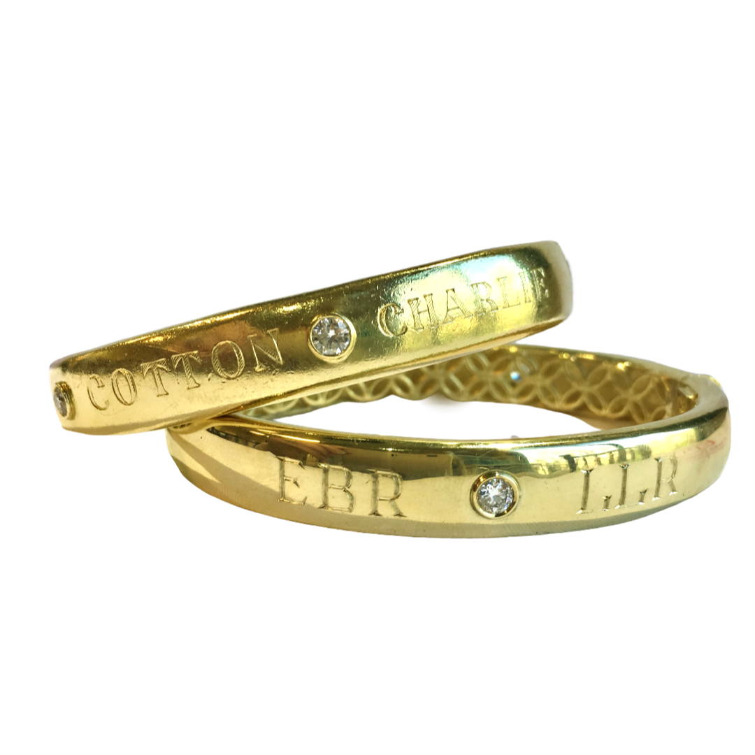 Custom designed 18K gold bracelets engraved with names and initials