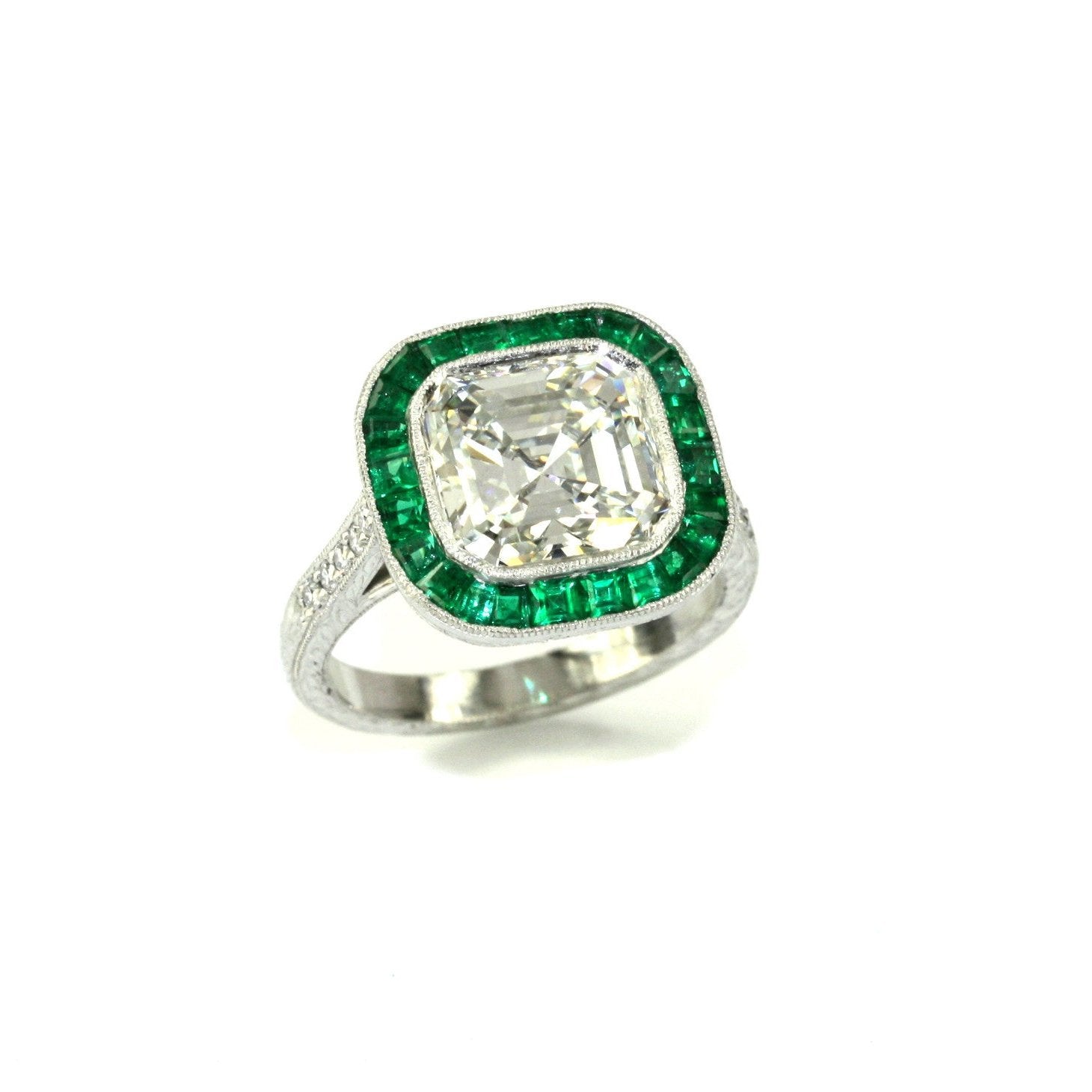 Custom designed Asscher Cut Diamond and emerald ring in Platinum