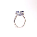 platinum ring with a blue sapphire gemstone on a white background