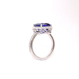 platinum ring with a blue sapphire gemstone on a white background