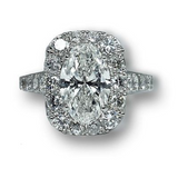 Custom designed Platinum Oval Diamond Ring wtih Diamond Halo