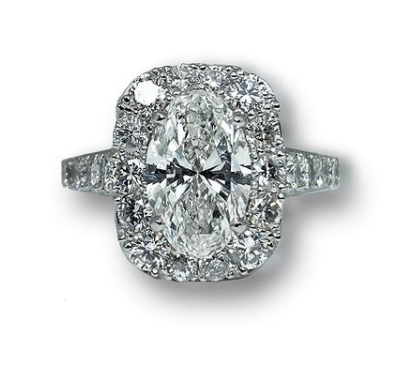 Custom designed Platinum Oval Diamond Ring wtih Diamond Halo