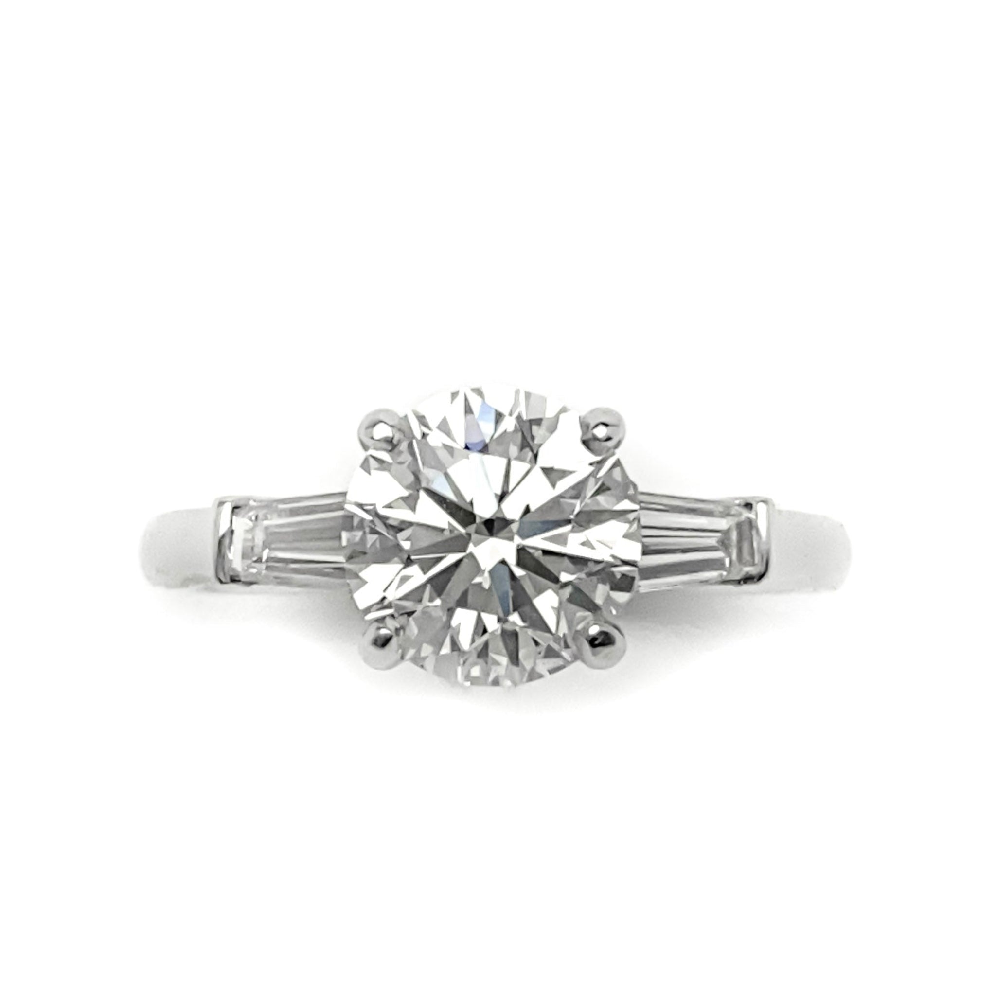 Top View of Custom Platinum Round Brilliant Cut Diamond with Tapered Baguettes on the side 