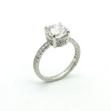 A platinum round diamond ring with a clear center diamond