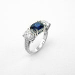 Custom designed platinum sapphire and diamond three stone ring