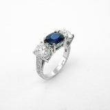 Custom designed platinum sapphire and diamond three stone ring