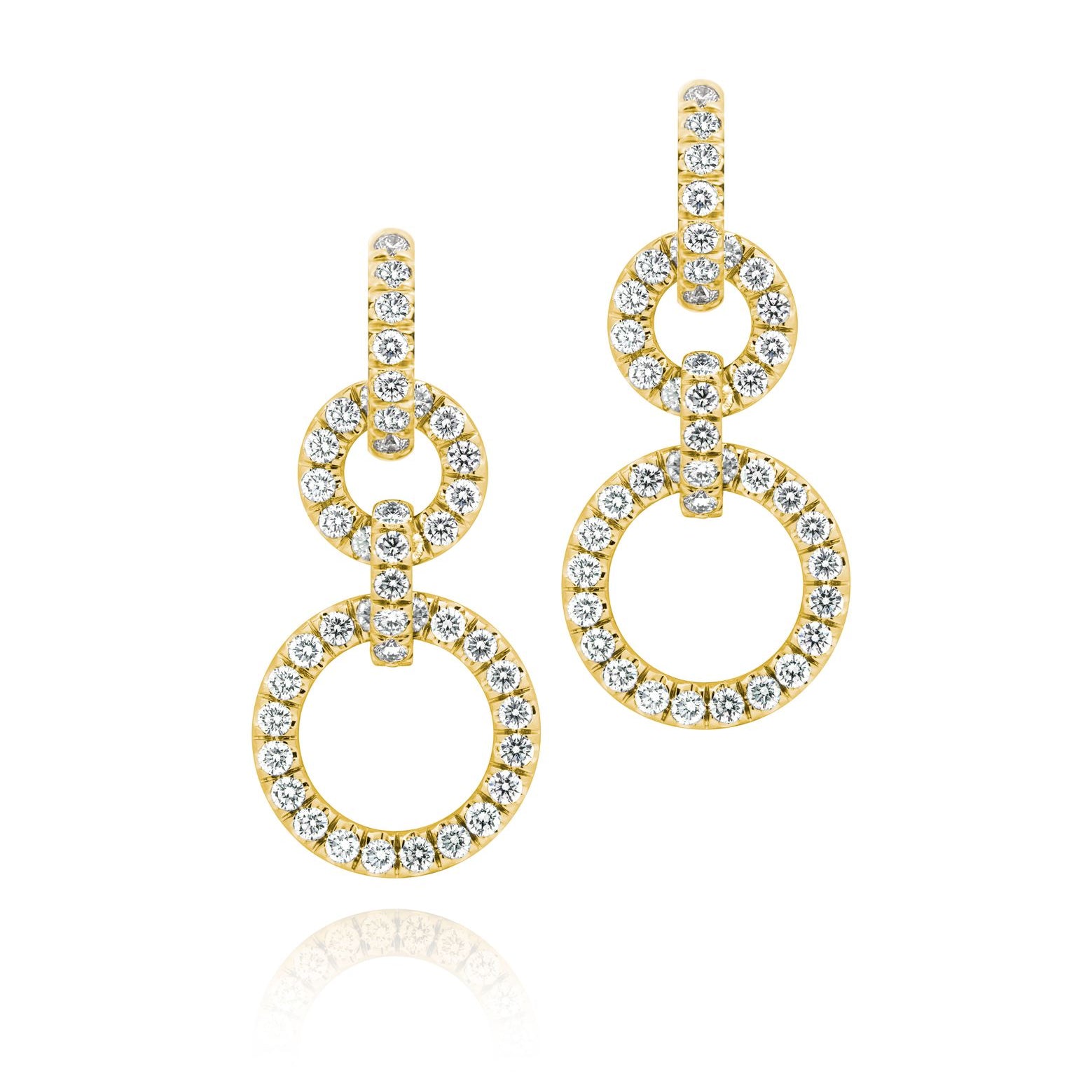 A pair of 18k gold and diamond drop convertible earrings with multiple circles linked together.