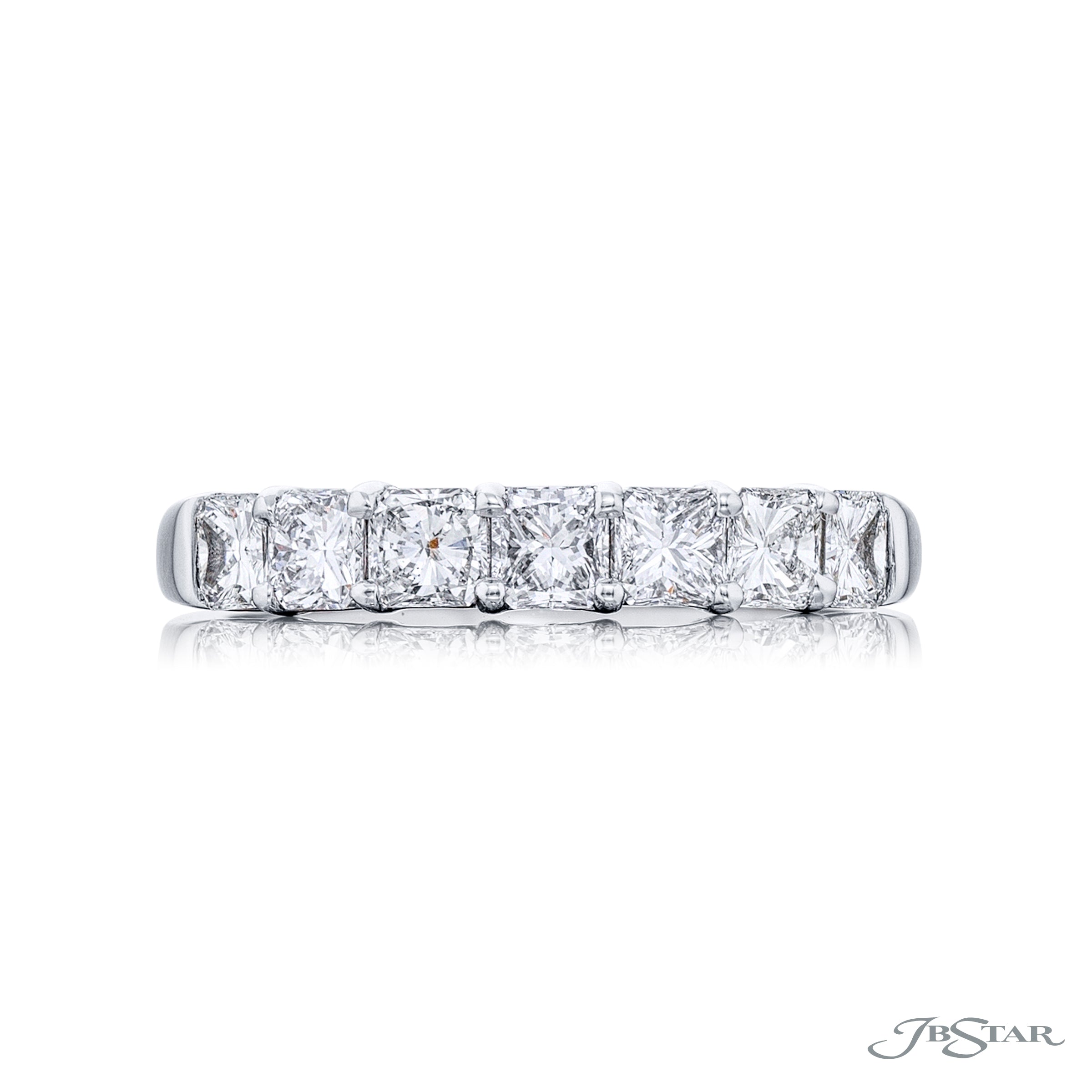 A platinum band ring with multiple diamonds set around its circumference.