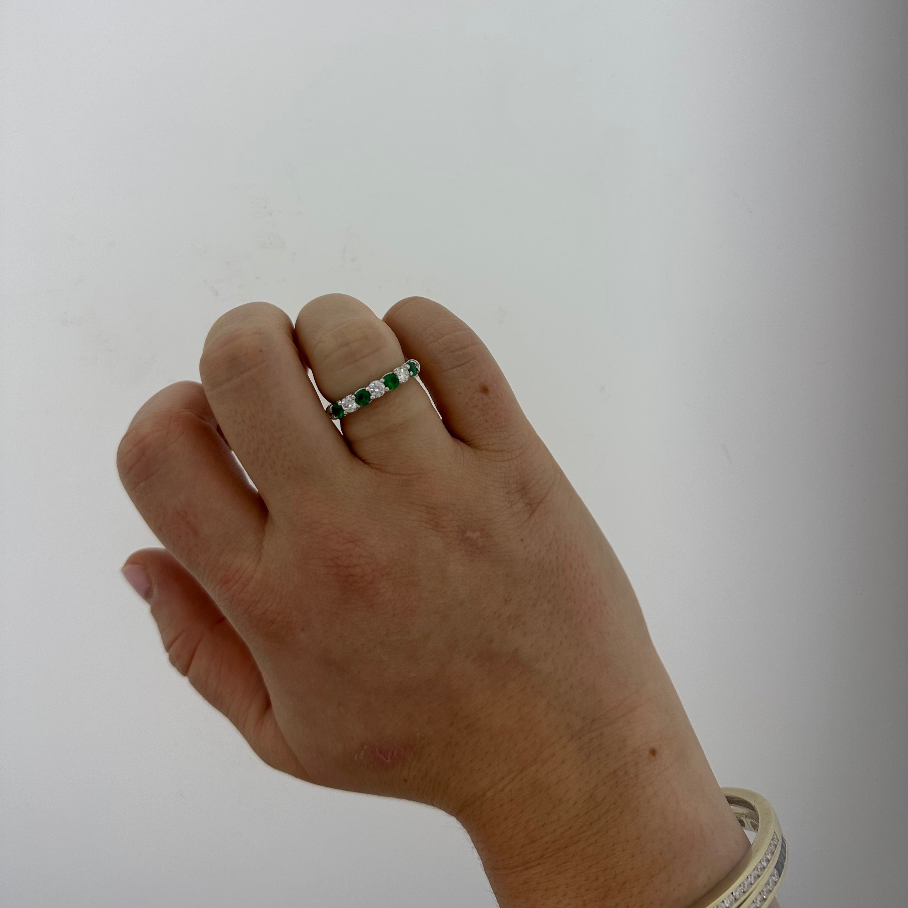 JB Star platinum round diamond and emerald band ring on model