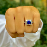 Woman wearing Platinum Sapphire and Diamond Ring designed by Laura Pearce