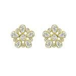 A pair of 18k yellow gold diamond stud earrings in a floral design.