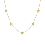 A 18k yellow gold necklace featuring a series of daisy flower stations along the chain.