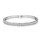 An 18K white gold engraved diamond bangle bracelet 