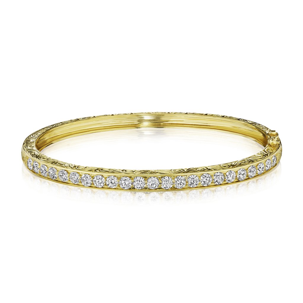 A Penny Preville 18K gold engraved diamond bangle bracelet 