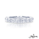 A platinum ring with multiple emerald cut diamonds