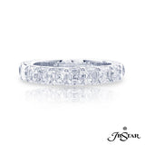 A platinum ring with multiple emerald cut diamonds