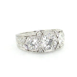 Platinum Art Deco Three Stone Round Diamond Ring laying down