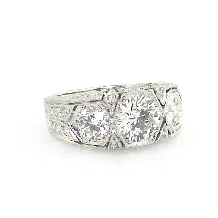 Platinum Art Deco Three Stone Round Diamond Ring laying down