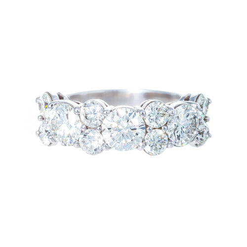 A platinum mixed round brilliant diamond band with multiple diamonds 