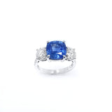 A platinum cushion cut sapphire and diamond ring with a total sapphire weight of 3.8 carats