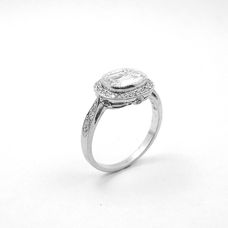 Platinum Emerald Cut Diamond Ring with Oval Diamond Halo
