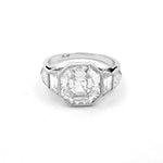 A platinum modified asscher cut diamond ring with a clear diamond 