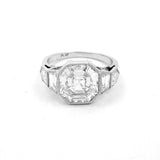 A platinum modified asscher cut diamond ring with a clear diamond 