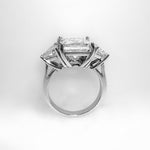 A platinum princess cut diamond ring with trillion side stones.