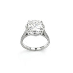 A platinum round diamond ring with a visible clear and precise cut diamond in a platinum band