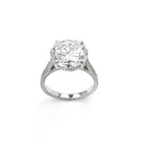 A platinum round diamond ring with a visible clear and precise cut diamond in a platinum band