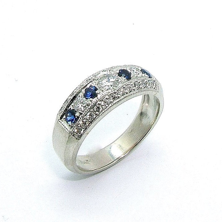 A platinum band ring with blue sapphires and diamonds