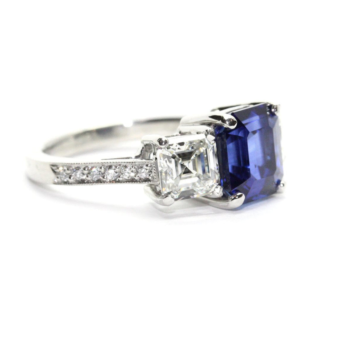 side view of platinum sapphire and diamond three stone ring