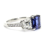 side view of platinum sapphire and diamond three stone ring