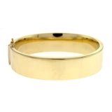 A 14K yellow gold flat polished bangle bracelet with a width of 15.8 mm.