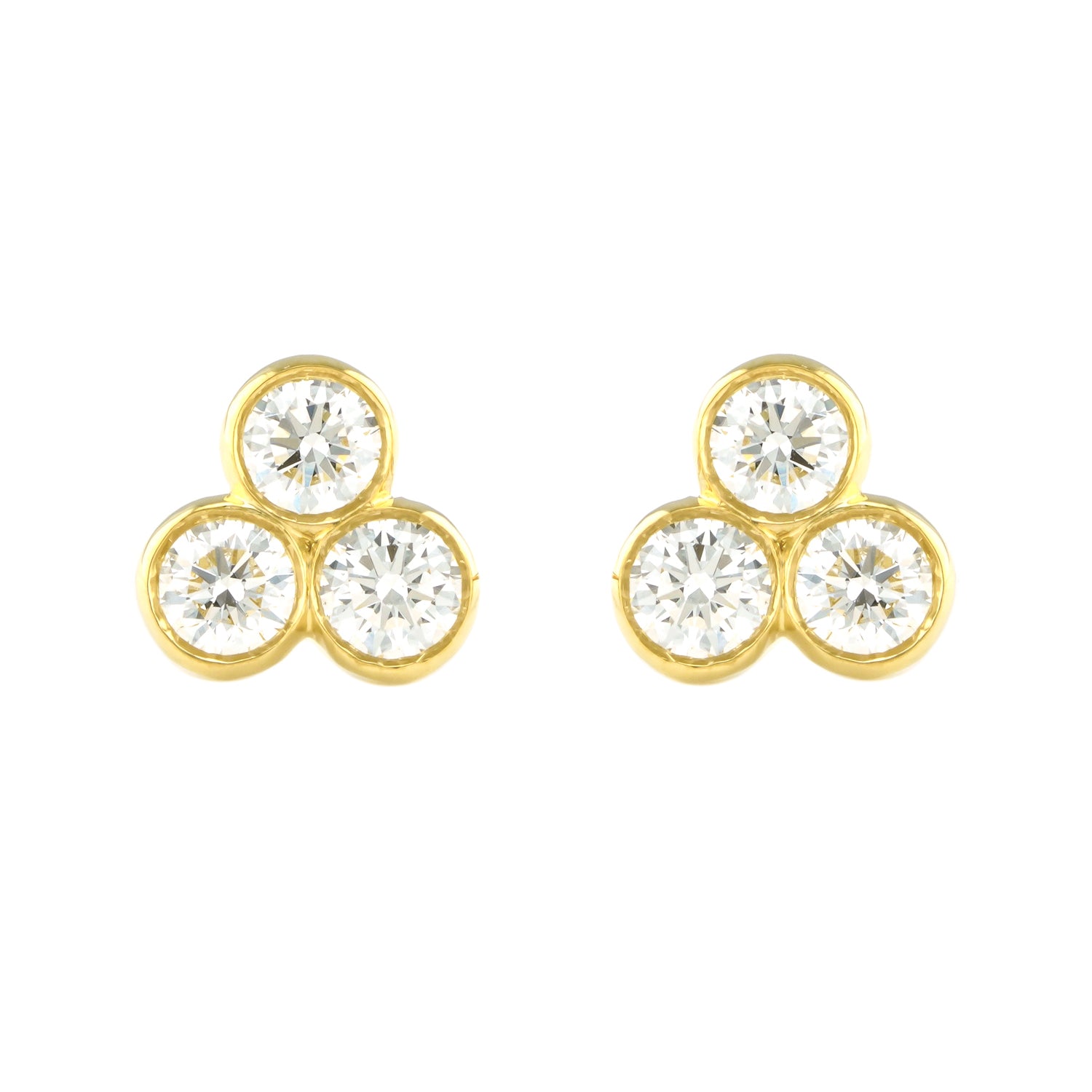 A pair of 18k yellow gold tri bezel diamond stud earrings.