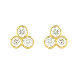 A pair of 18k yellow gold tri bezel diamond stud earrings.