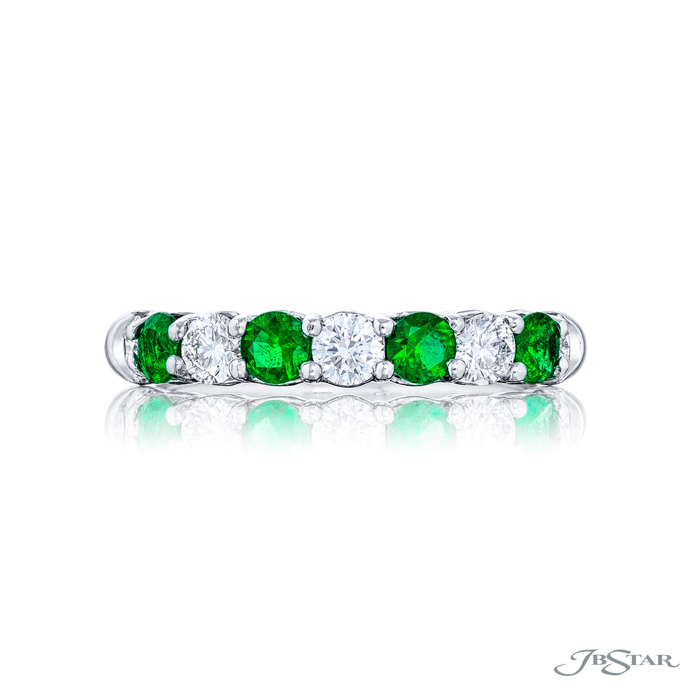 A JB Star platinum band ring with round diamonds and emeralds alternate placement