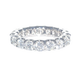 A platinum eternity band ring with shared prong set diamonds 3.83 carats