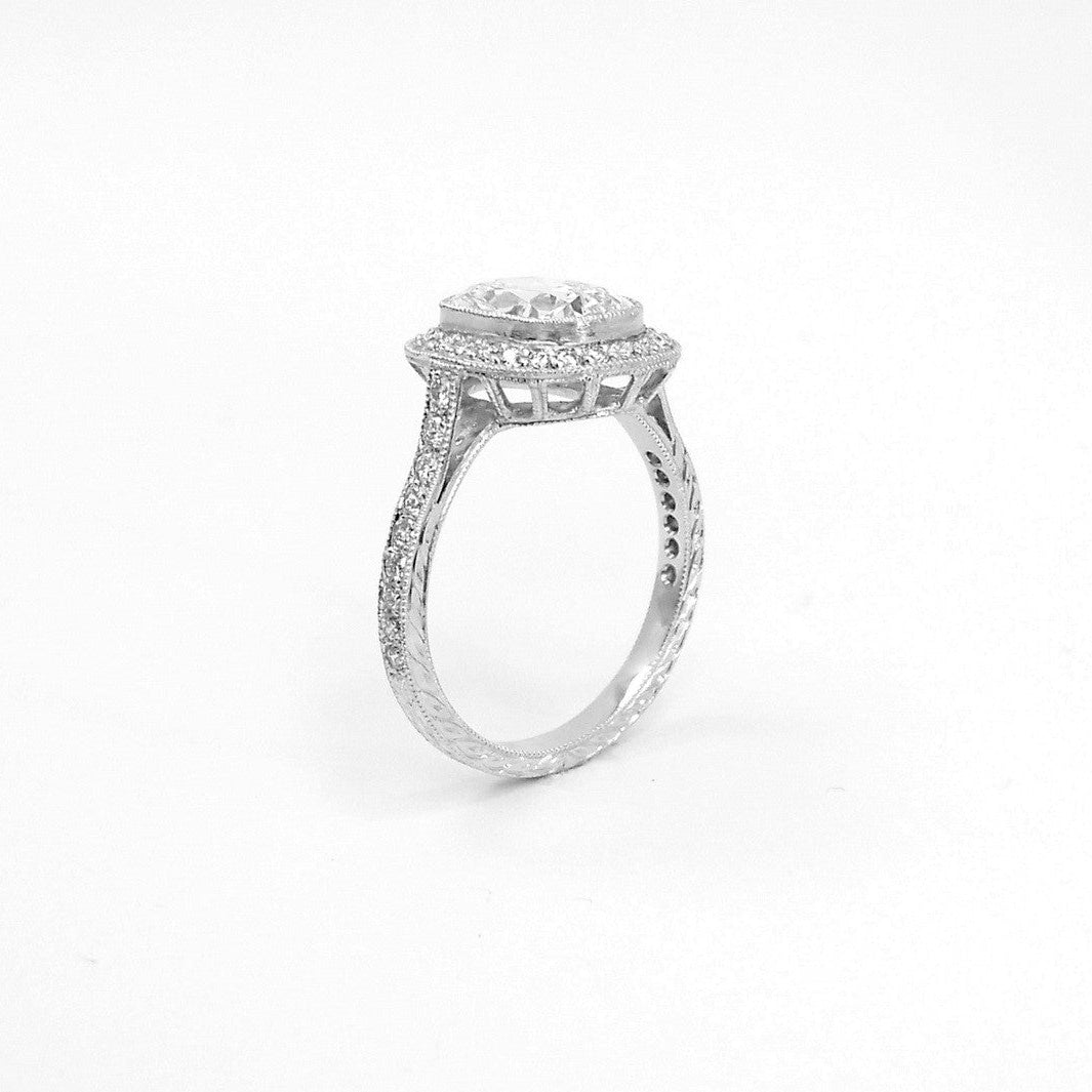 Side view of custom made platinum cushion cut diamond engagement ring