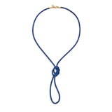A blue leather cord necklace with a gold clasp and a knot detail 
