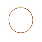 A brown leather cord necklace with a 18K yellow gold clasp designed by Temple St Clair