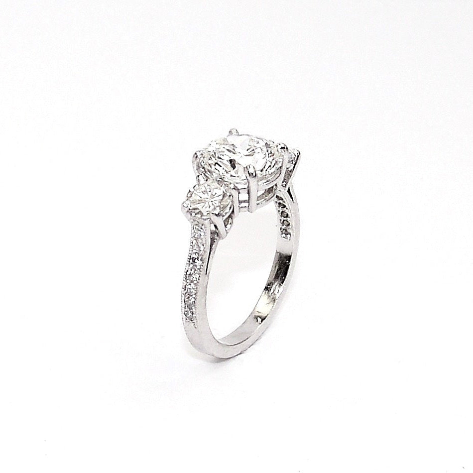 Three Stone Round Brilliant Cut Diamond Engagement Ring in Platinum