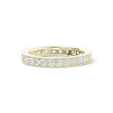 A 18k yellow gold bead set diamond band ring