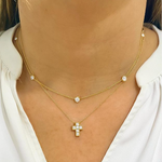 Woman wearing a diamond by the yard necklace