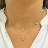 Woman wearing a diamond by the yard necklace
